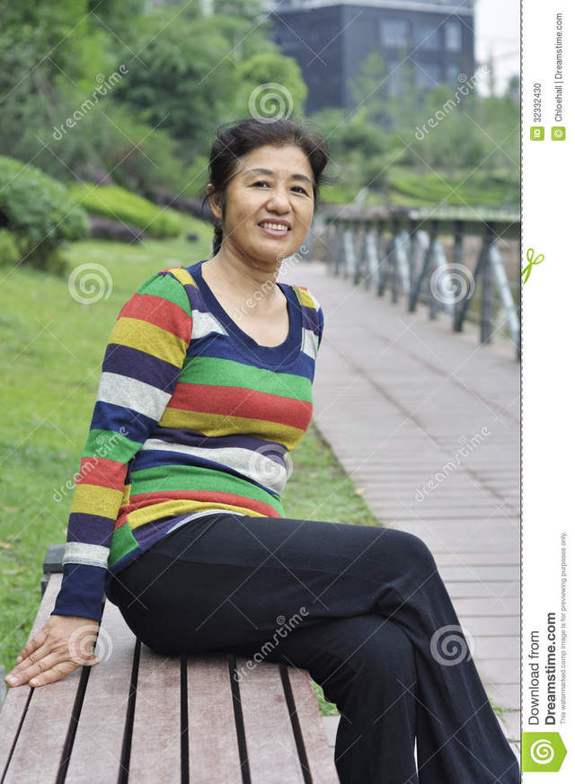 asian mature pics mature woman photo asian sitting happy outdoors stock bench
