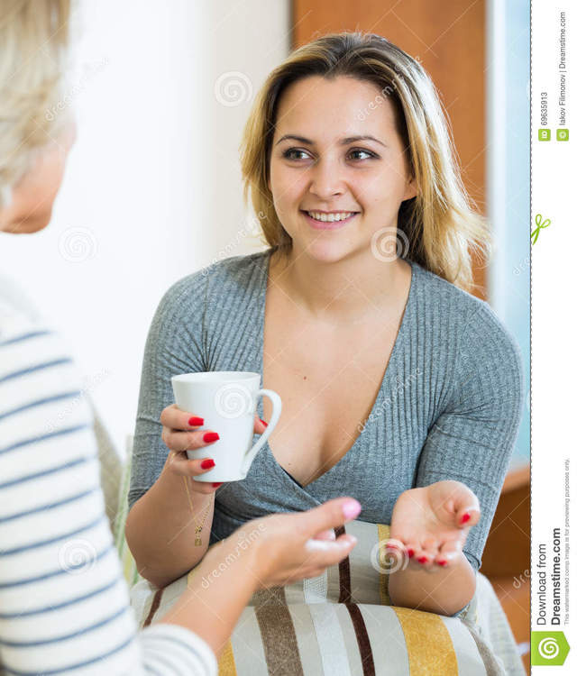mature mom mature mom women young girl photo daughter senior happy tea talking sharing stock drinking gossips drinkin