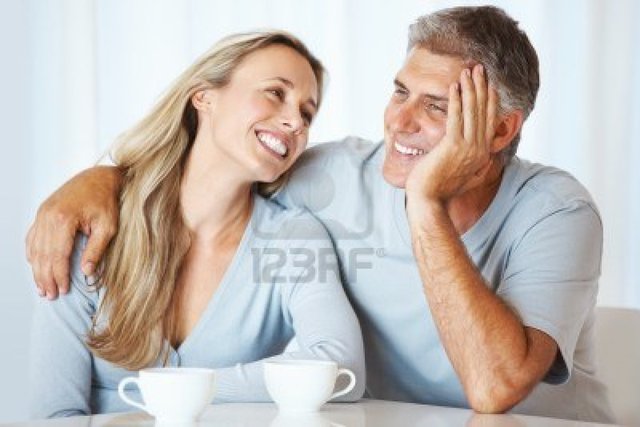 mature photos mature couple love photo having cup tea together logos portrait indoors