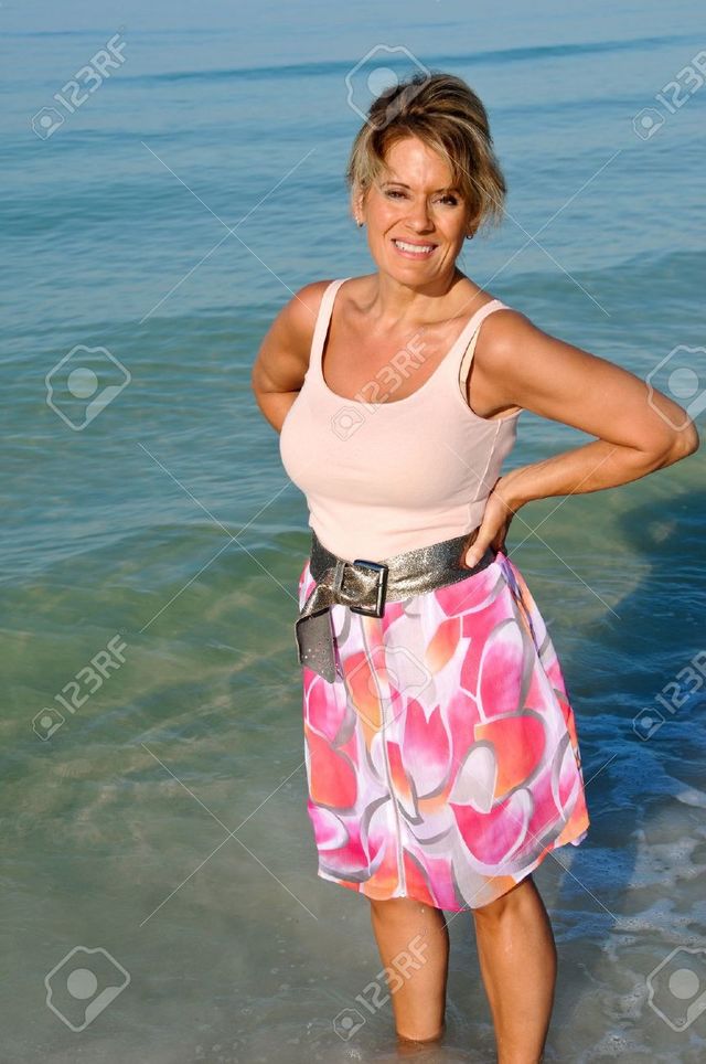 mature sexy mature woman photo standing stock attractive fifty ocean surf eyemark