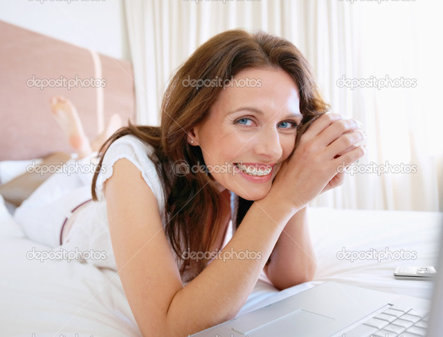 middle age mature porn mature woman bed date depositphotos portrait laptop joyous