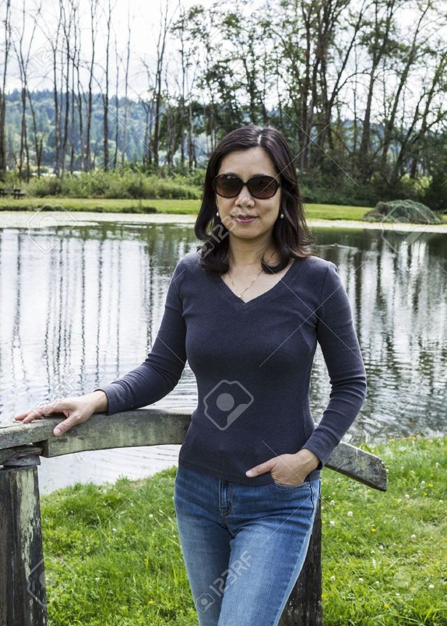 asia mature mature women photo asian background chinese standing trees stock lake tab wooden bridge
