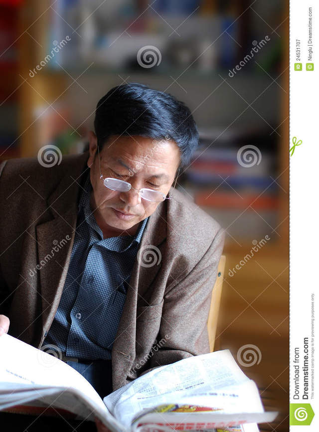 asian mature mature free asian man news stock photography reading royalty