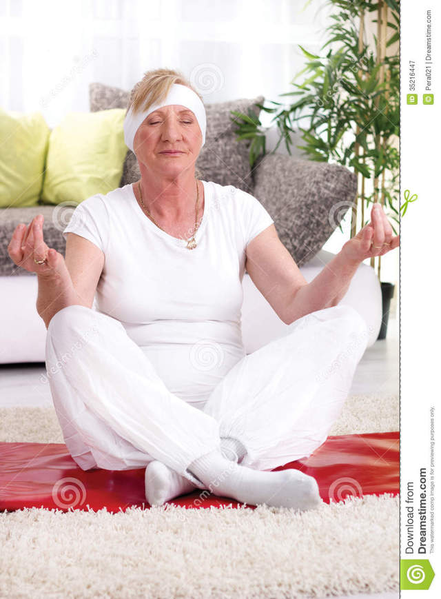 beautiful mature mature free woman home beautiful senior yoga stock photography exercise pose smiling royalty lotus