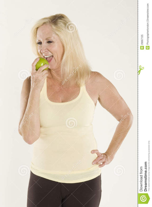 beautiful mature mature free woman photo beautiful eating fresh stock green apple royalty