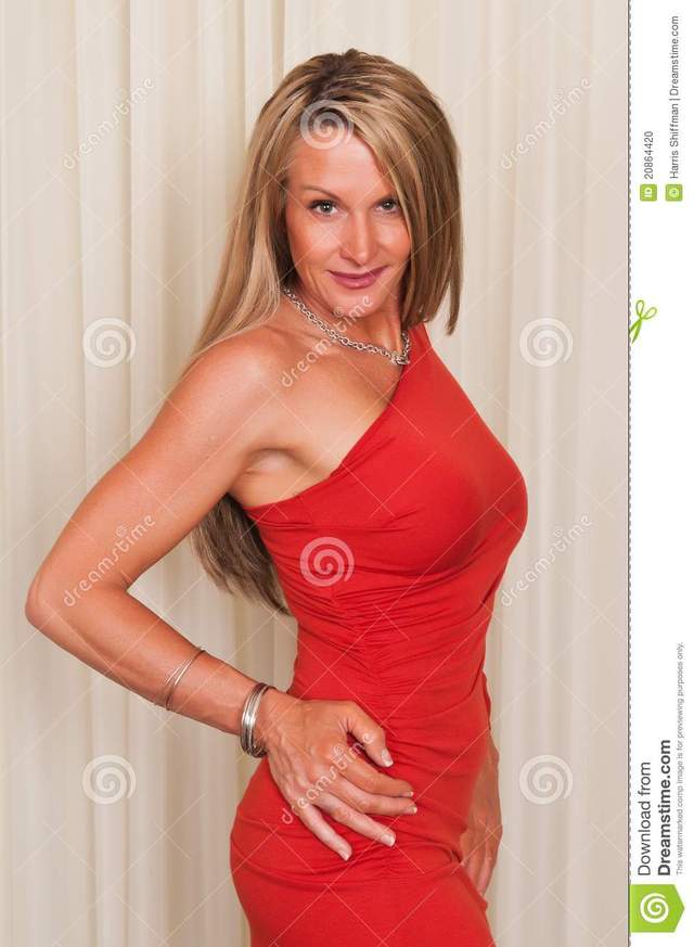 mature blonde photo red dress stock