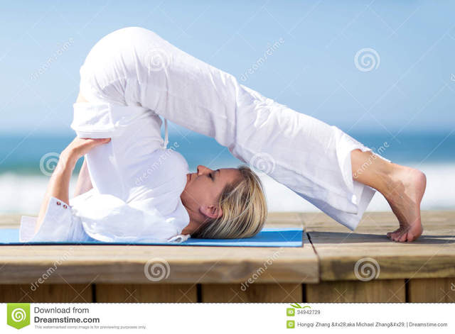 mature flexible mature free woman beach yoga stock flexible royalty