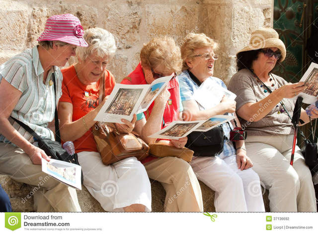 mature group mature group sitting female stock photography outside church holy holding tourists sepulchre brochures