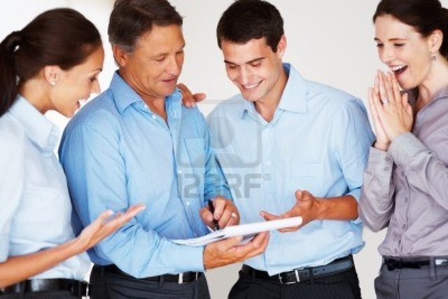 mature group mature group photo over business logos holding agreement executive executives proposal notebook