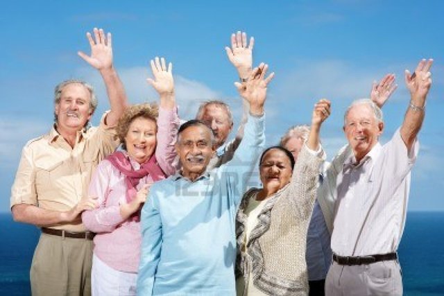 mature group mature group photo outdoor sky logos portrait standing friends against hands raised