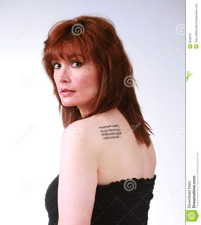 mature tattoo chick tattoo stock