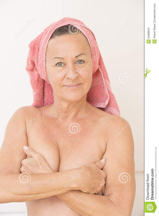 pictures of mature women naked mature woman naked women beautiful breasts head happy friendly portrait hands smiling towel covering relaxed