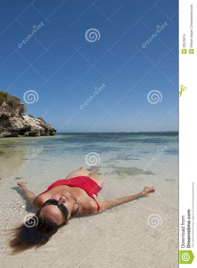 purple porn mature mature nude woman blue photo beach background sky seductive stock pose tropical laying