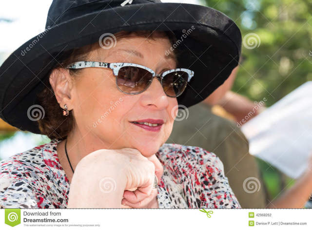red mature mature woman black photo hat close shot wearing red head senior glasses stock lipstick sunglasses shallow depth fashionable