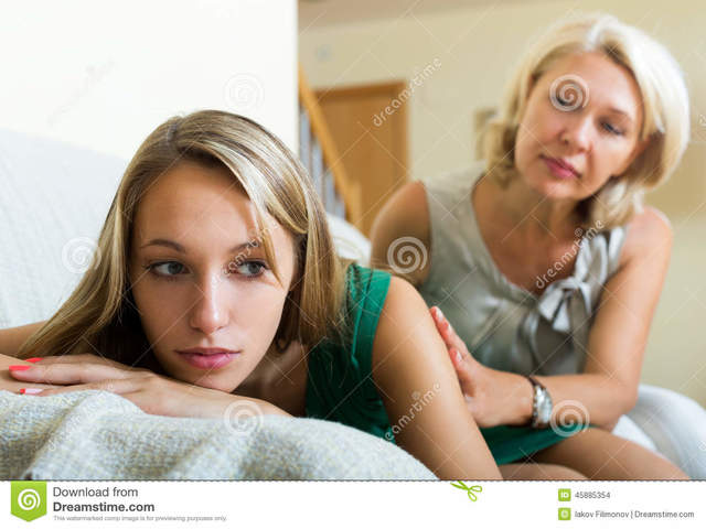 teen and mature mature mother photo home daughter sad teenage crying stock comforting