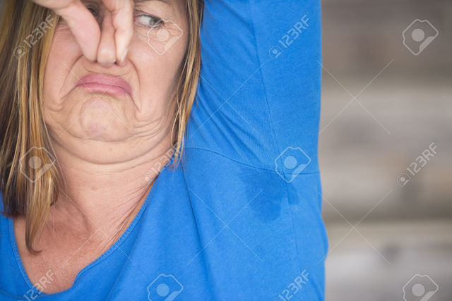 wet mature mature woman wet photo under smelly shirt spot portrait stock roboriginal arm sweat perspiration moisture blurr