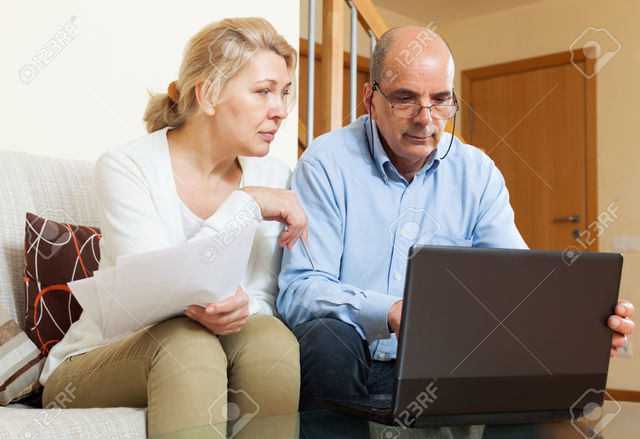 wife mature mature wife photo man home using business senior stock reading interior jackf laptop documents
