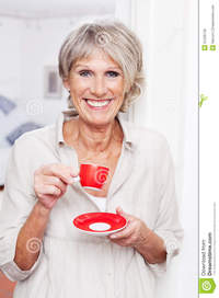 old picture porn woman vivacious older woman drinking espresso coffee modern small red cup standing indoors smiling viewer royalty free stock happy old using