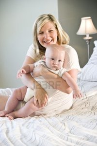 older porn woman media original hot mom hugging porcine seven month old baby stock photo