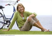 images mature women photo mature woman grass bicycle sea smiling portrait