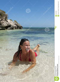 mature beach porn pictures mature woman tropical beach nude laying blue sky background stock photo