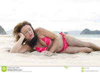 mature bikini pics woman sunbathing beach royalty free stock photos