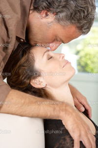 mature close up depositphotos close mature man kissing womans forehead lounging homes living room stock photo