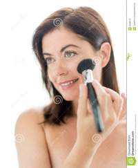 mature face pics attractive woman applying makeup face portrait beautiful mature lady forties using professional brush apply powder royalty free stock photography