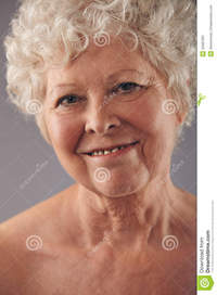 mature face pics attractive senior woman face sweet smile headshot against grey background positive mature stock photo