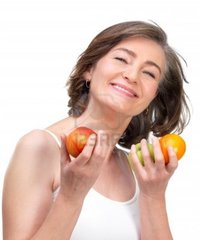 mature image logos mature woman holding fruit against white background photo