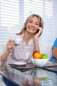 mature image leaf portrait mature woman talking cell phone having cup tea photo