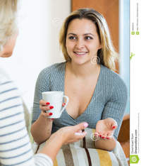 mature mom happy daughter sharing gossips mature mom tea drinkin senior women young girl talking drinking stock photo