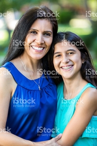 mature mom photos mature hispanic mom smiling preteen daughter picture photo