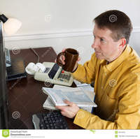 mature office porn pics drinking coffee doing income taxes photo mature man looking data computer monitor working his holding cup women from home office stock