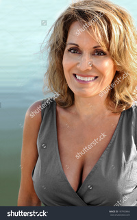mature photos stock photo pretty mature woman wearing grey summer dress pic