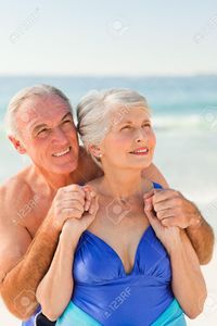 mature wife pic man hugging his wife beach stock photo mature woman