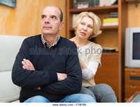 mature wife pic zooms guilty mature wife asking husband forgiveness stock photo