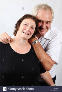 mature wife pic comp older mature married couple husband wife cuddling looking happy stock photo