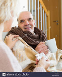 mature wife pix comp famrja attentive mature wife giving medicine sick husband home stock photo