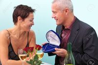 mature wife pix rtimages photo mature man giving his wife diamond necklace whilst sat table restaurant stock