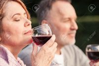 mature wife pix iakovenko cute mature husband wife are drinking wine joy they sitting grass smiling stock photo