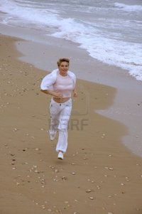 mature women photo pooh beautiful mature women running beach sea photo