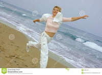mature women photo beautiful mature women running beach stock