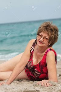 mature women pictures isame mature woman relaxing beach stock photo women older