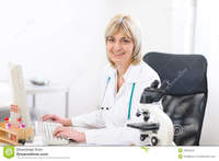 middle age mature porn portrait smiling mature doctor woman lab middle age working computer