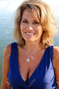 photo of mature women eyemark pretty woman wearing blue summer dress stock photo mature