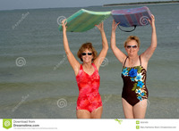 photo of mature women active mature women beach stock photos