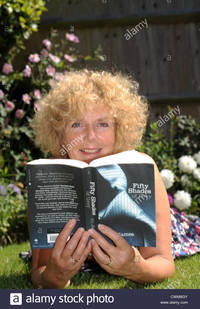 pics of sexy mature comp cwm mature woman reading sexy erotic novel fifty shades grey stock photo