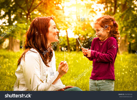 sexy mom having sex with daughter stock photo mother small daughter blowing dandelion lifestyle outdoors scene park pleasure search