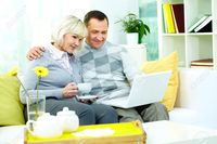 wife mature pic pressmaster portrait mature man his wife working laptop home stock photo